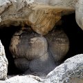 Хитровыгрызенные в скалах пещеры темными дырками смотрят на текущие вокруг струи кипящей воды.
            